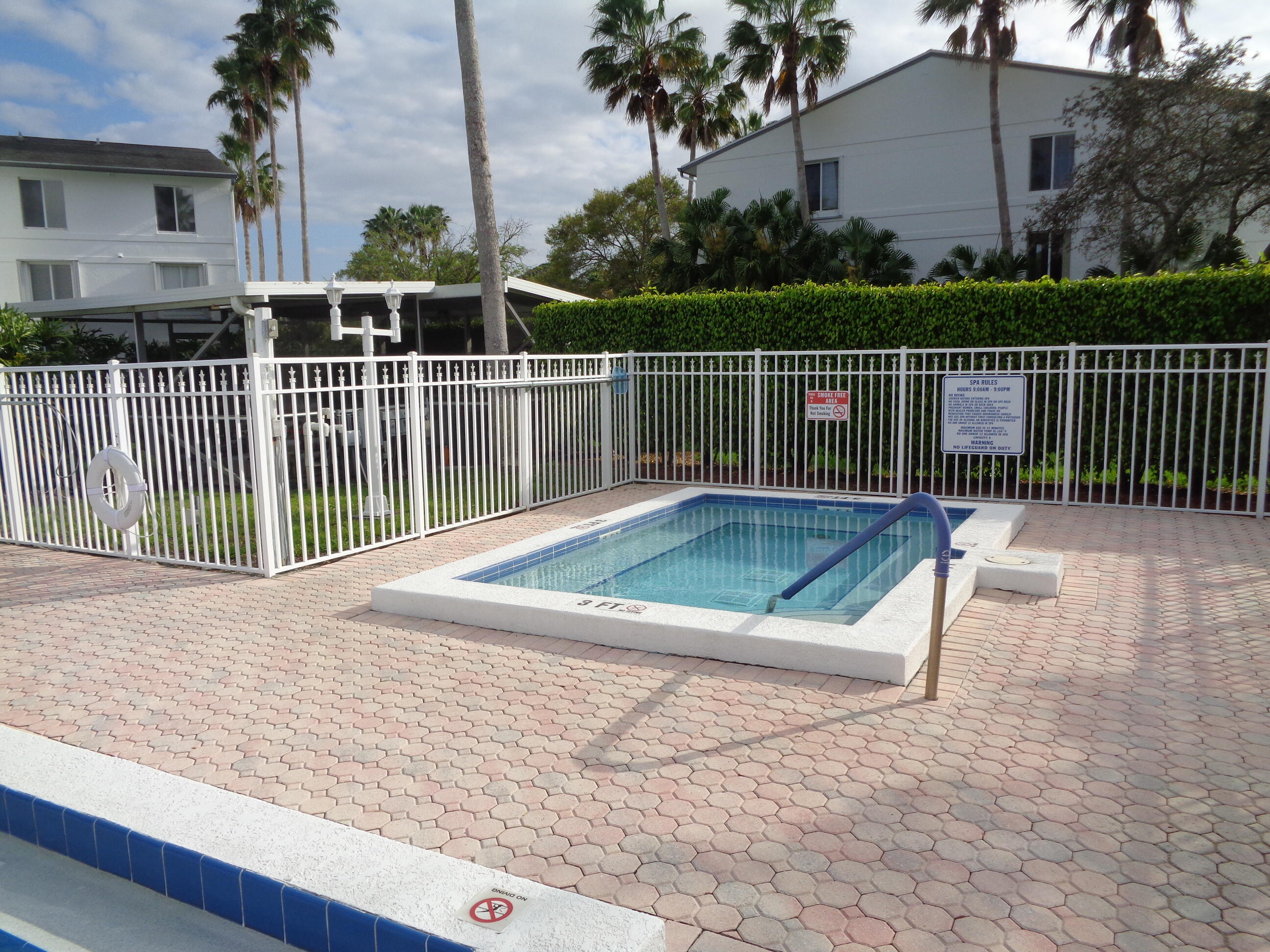 2518 Southeast Anchorage Cove, Unit G2 Port St. Lucie, FL 34952 - Photo 15 of 37 a view of a balcony with wooden floor