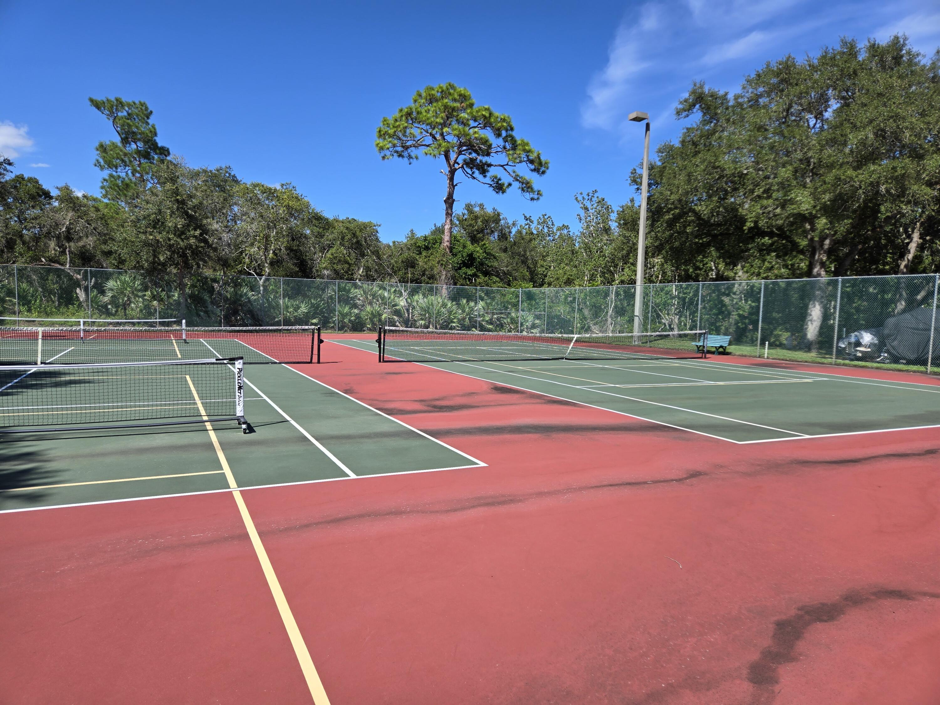 2518 Southeast Anchorage Cove, Unit G2 Port St. Lucie, FL 34952 - Photo 20 of 37 a view of an outdoor space and tennis court