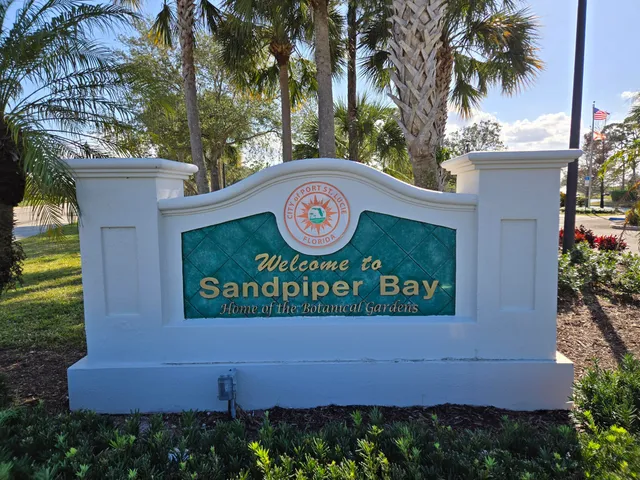 a sign that is on a brick wall