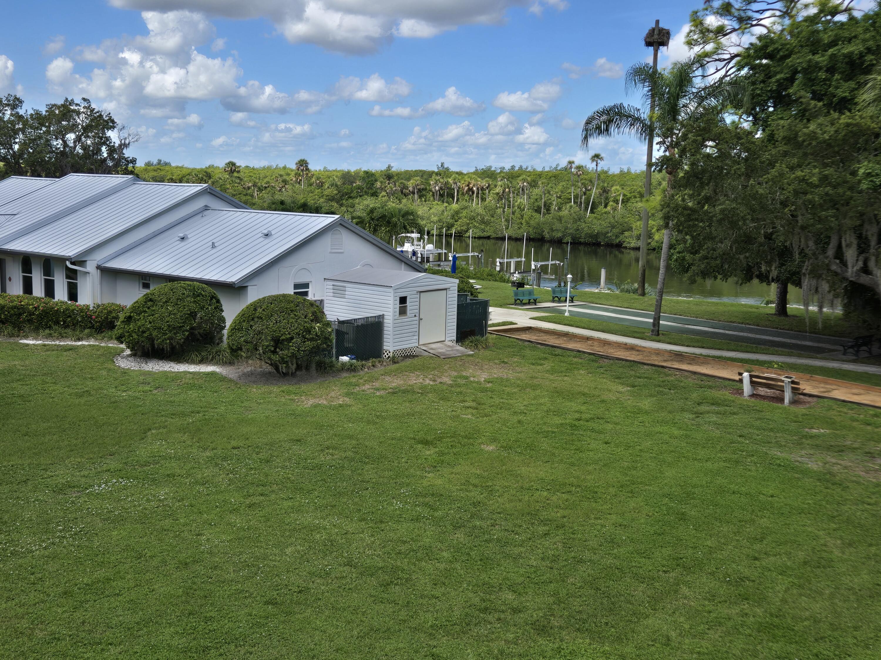 2518 Southeast Anchorage Cove, Unit G2 Port St. Lucie, FL 34952 - Photo 3 of 37 a view of a house with a big yard