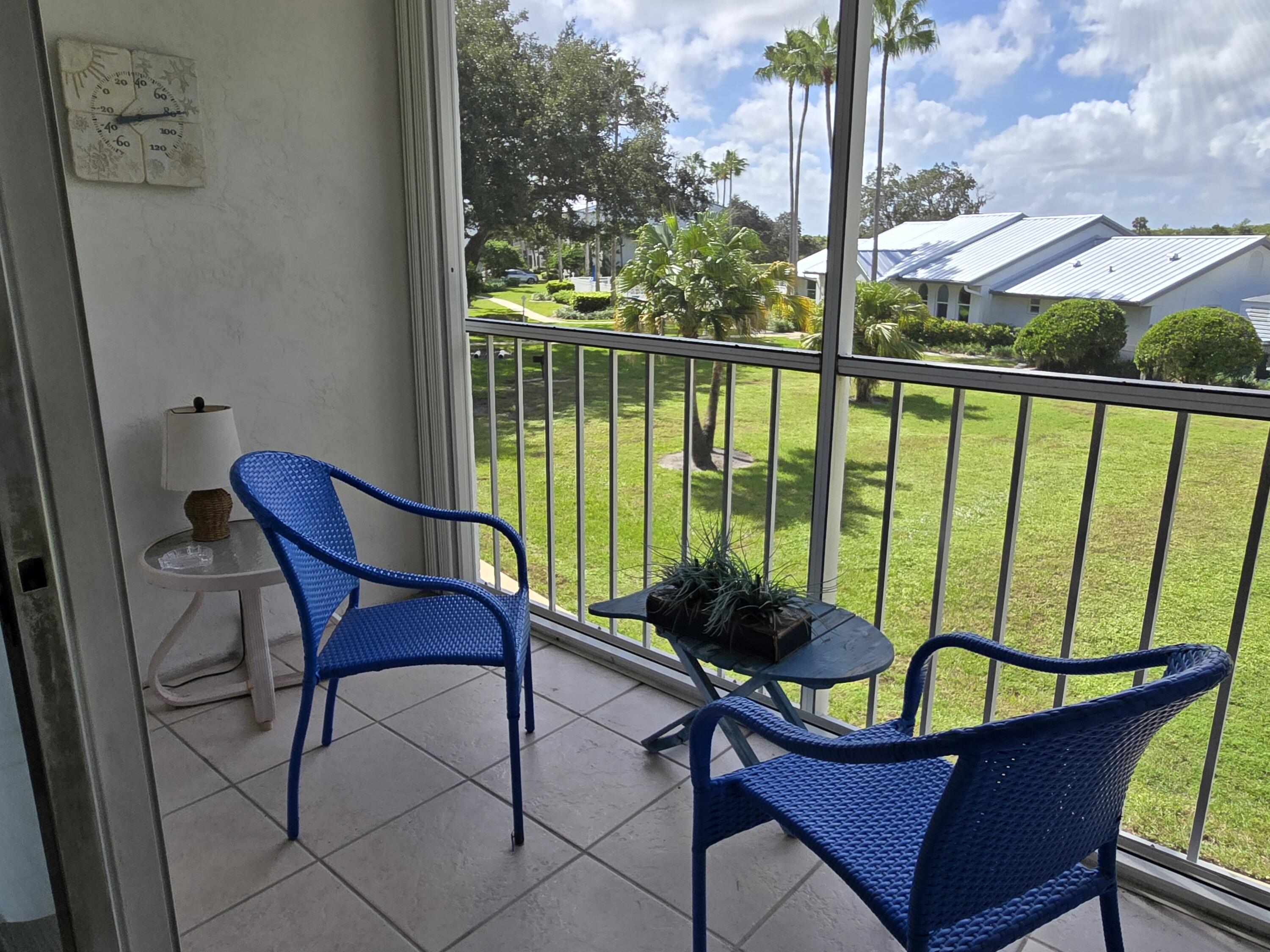 2518 Southeast Anchorage Cove, Unit G2 Port St. Lucie, FL 34952 - Photo 36 of 37 a view of a chairs and table in the balcony