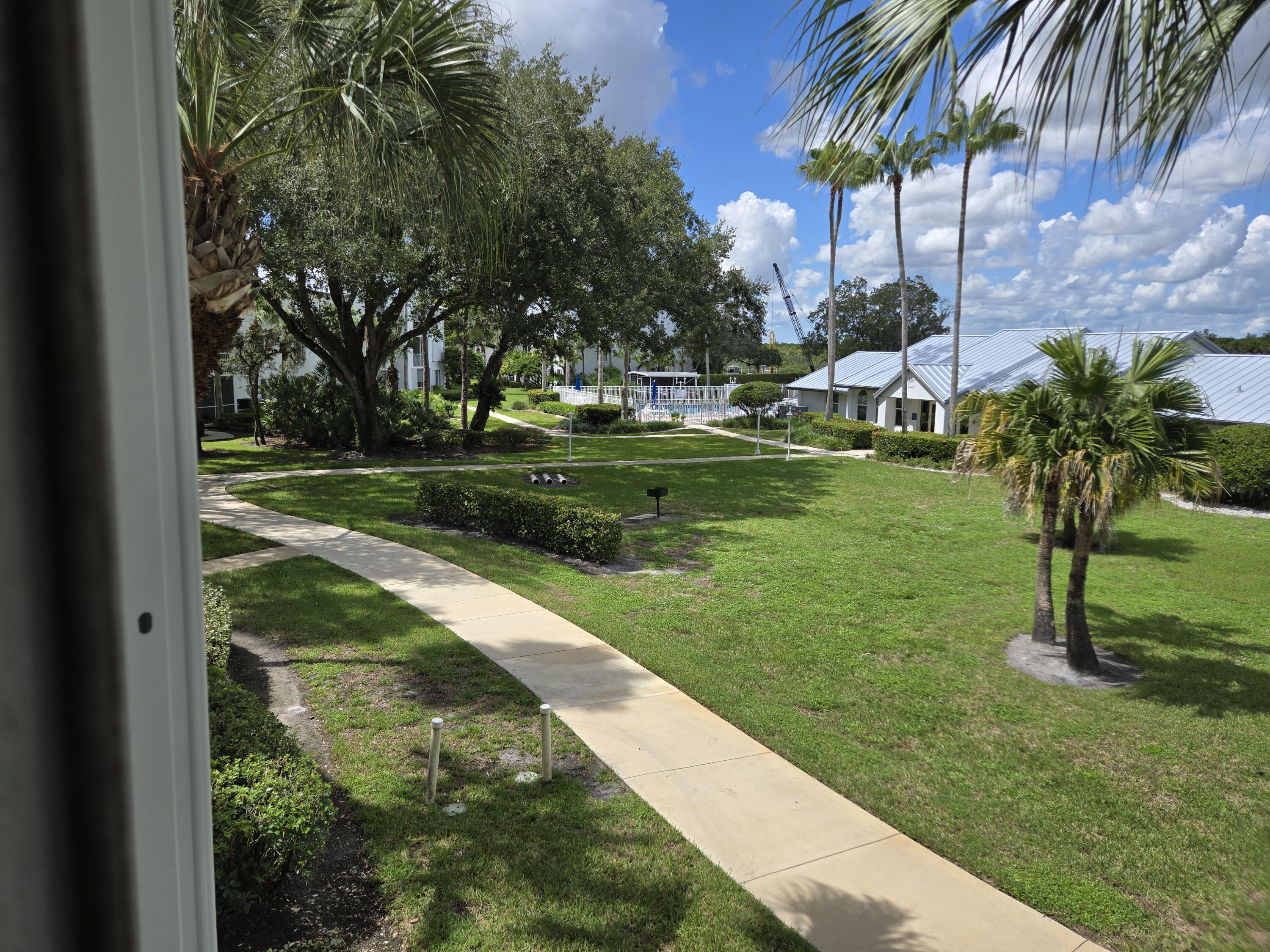 2518 Southeast Anchorage Cove, Unit G2 Port St. Lucie, FL 34952 - Photo 37 of 37 a garden view with a fountain