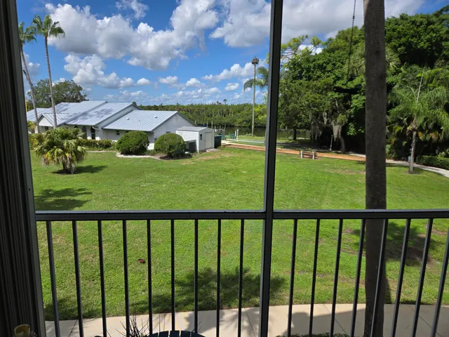 a view of a garden from a balcony