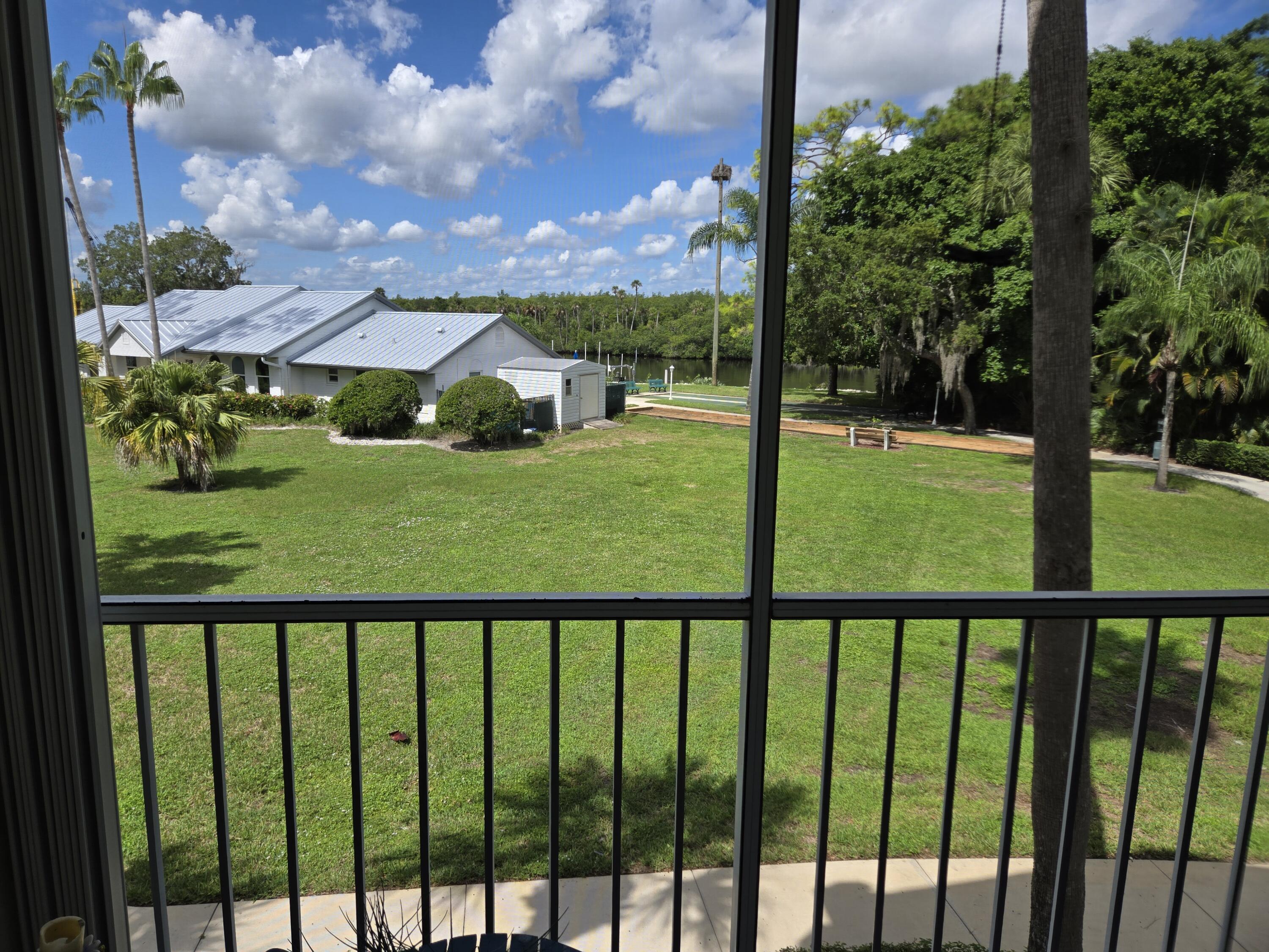 2518 Southeast Anchorage Cove, Unit G2 Port St. Lucie, FL 34952 - Photo 4 of 37 a view of a garden from a balcony
