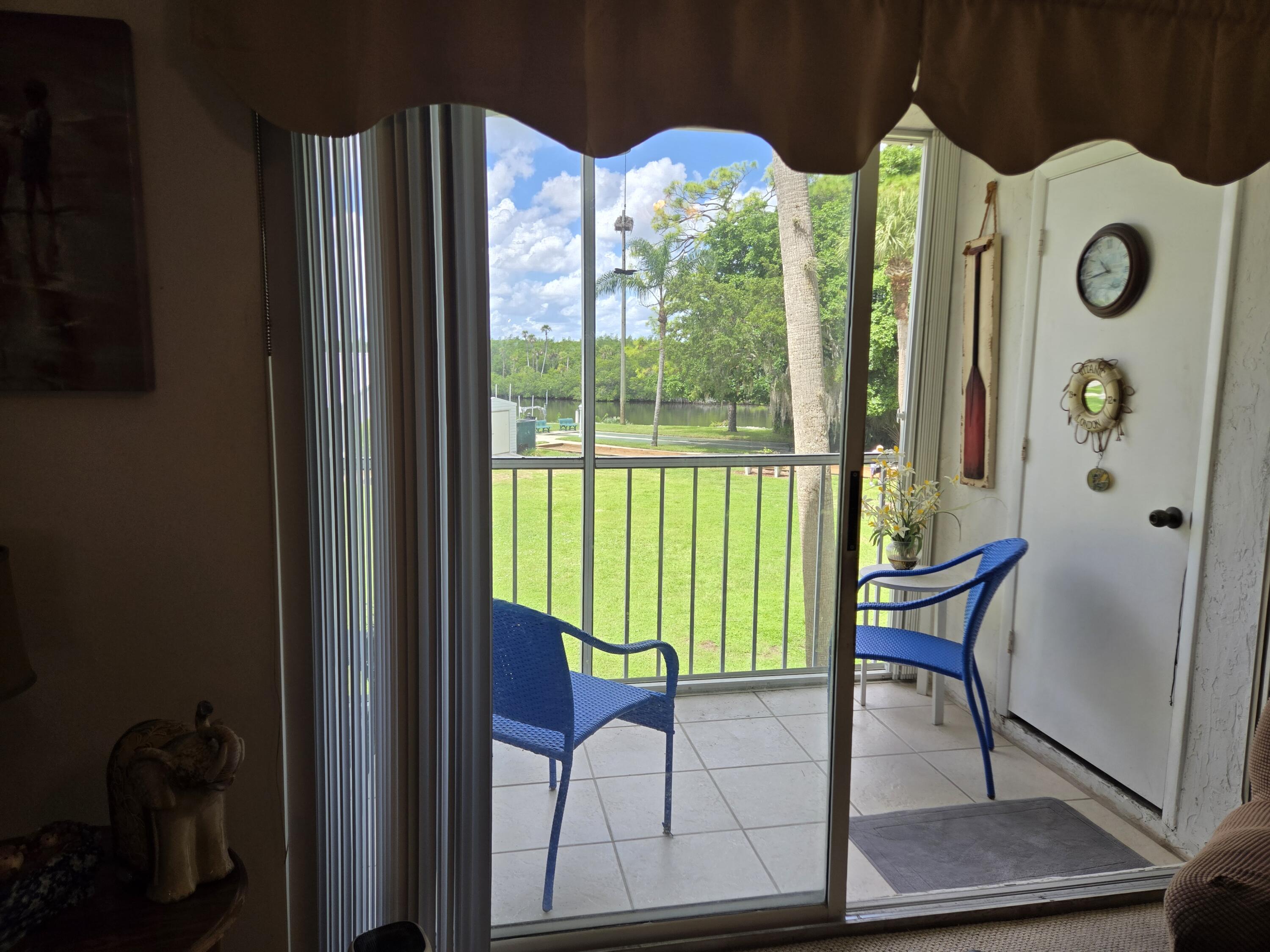2518 Southeast Anchorage Cove, Unit G2 Port St. Lucie, FL 34952 - Photo 5 of 37 a view of entryway livingroom and hall