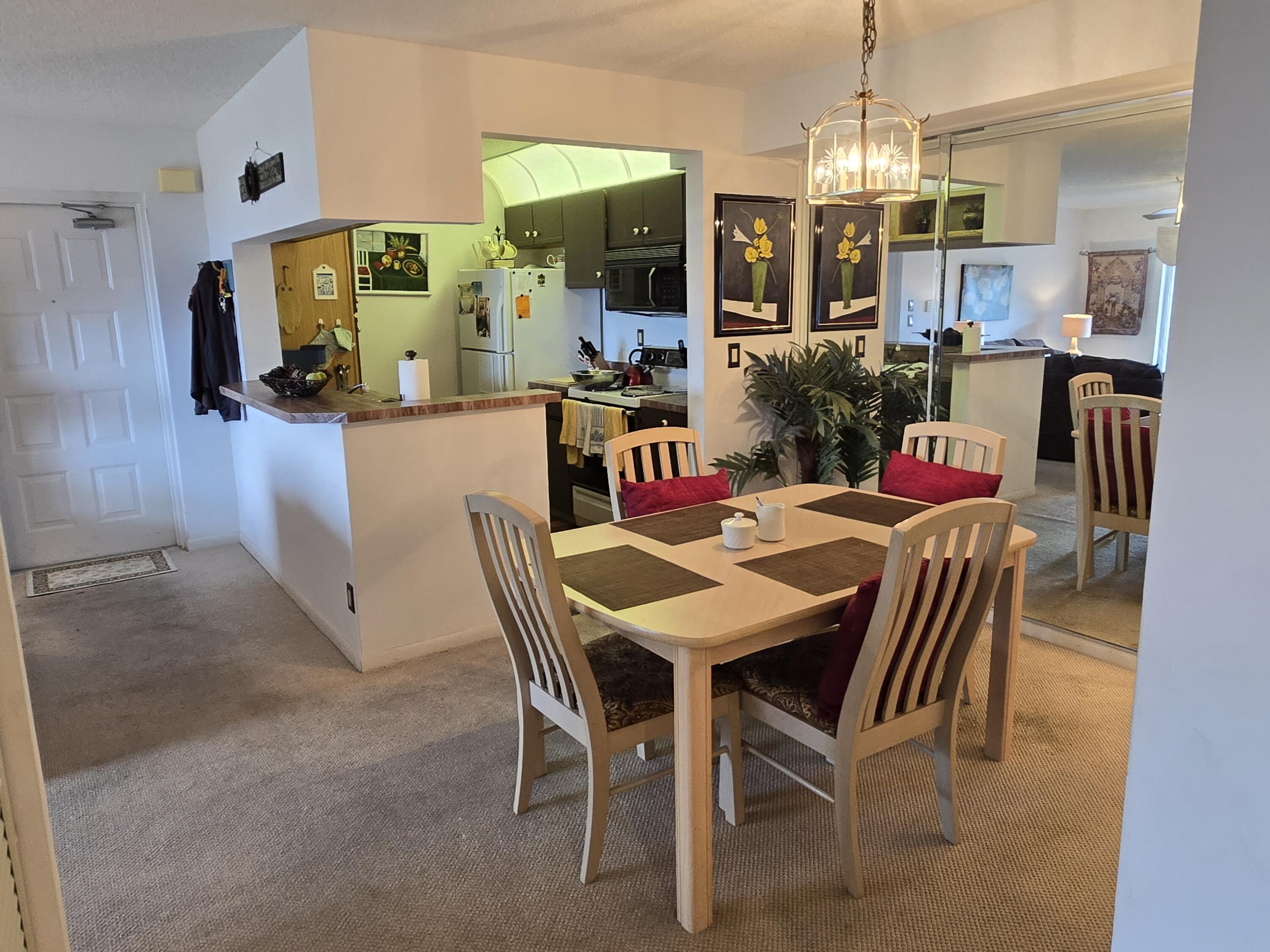 2518 Southeast Anchorage Cove, Unit G2 Port St. Lucie, FL 34952 - Photo 8 of 37 a view of a dining room with furniture