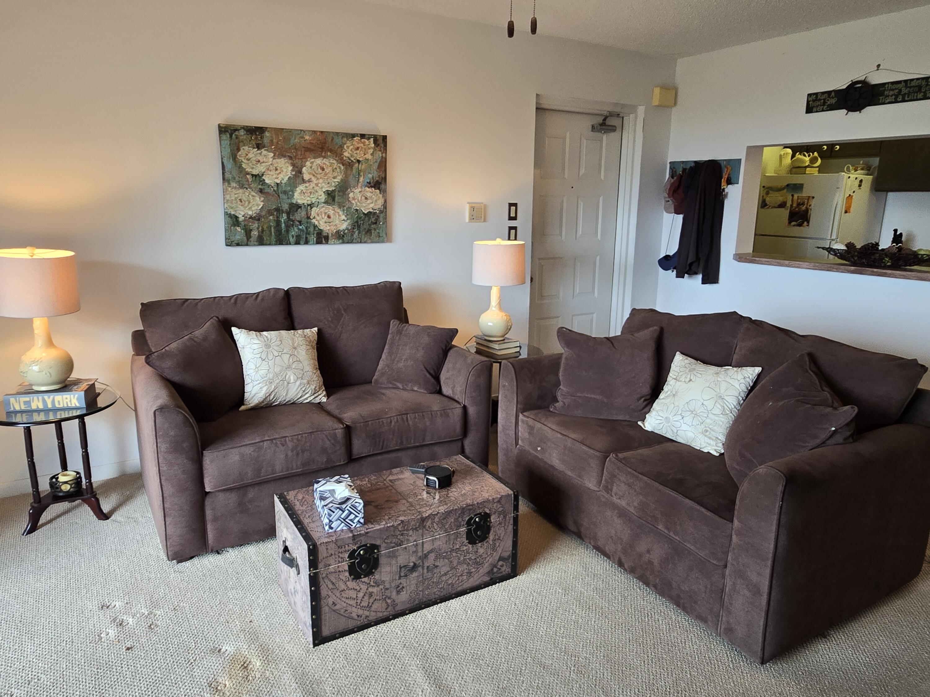 2518 Southeast Anchorage Cove, Unit G2 Port St. Lucie, FL 34952 - Photo 9 of 37 a living room with furniture and a painting