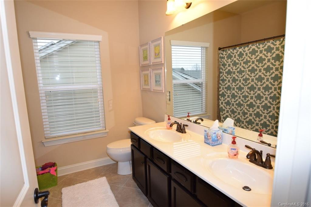 3034 Fallondale Road Waxhaw, NC 28173 - Photo 17 of 22 a bathroom with a sink a toilet and a window