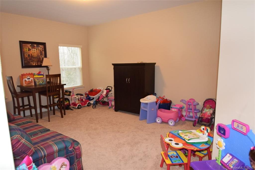 3034 Fallondale Road Waxhaw, NC 28173 - Photo 20 of 22 a bedroom with furniture and a large window