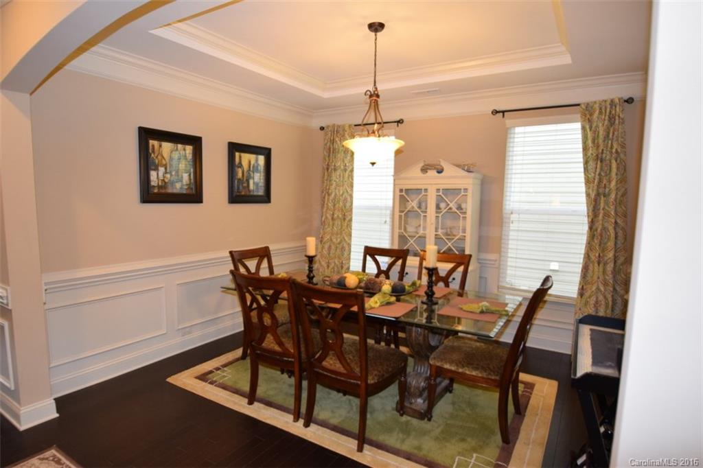 3034 Fallondale Road Waxhaw, NC 28173 - Photo 4 of 22 a view of a dining room with furniture window and wooden floor