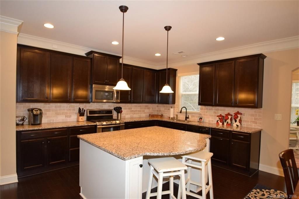 3034 Fallondale Road Waxhaw, NC 28173 - Photo 6 of 22 a kitchen with a sink and a stove