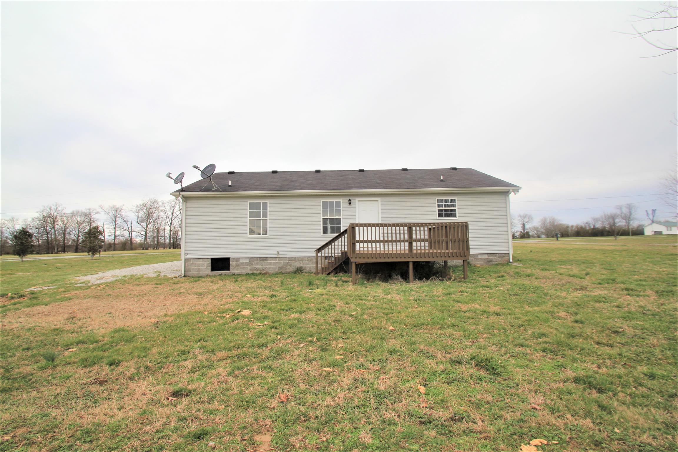 131 Spry Road Morrison, TN 37357 - Photo 11 of 11 a view of house with backyard space and lake view