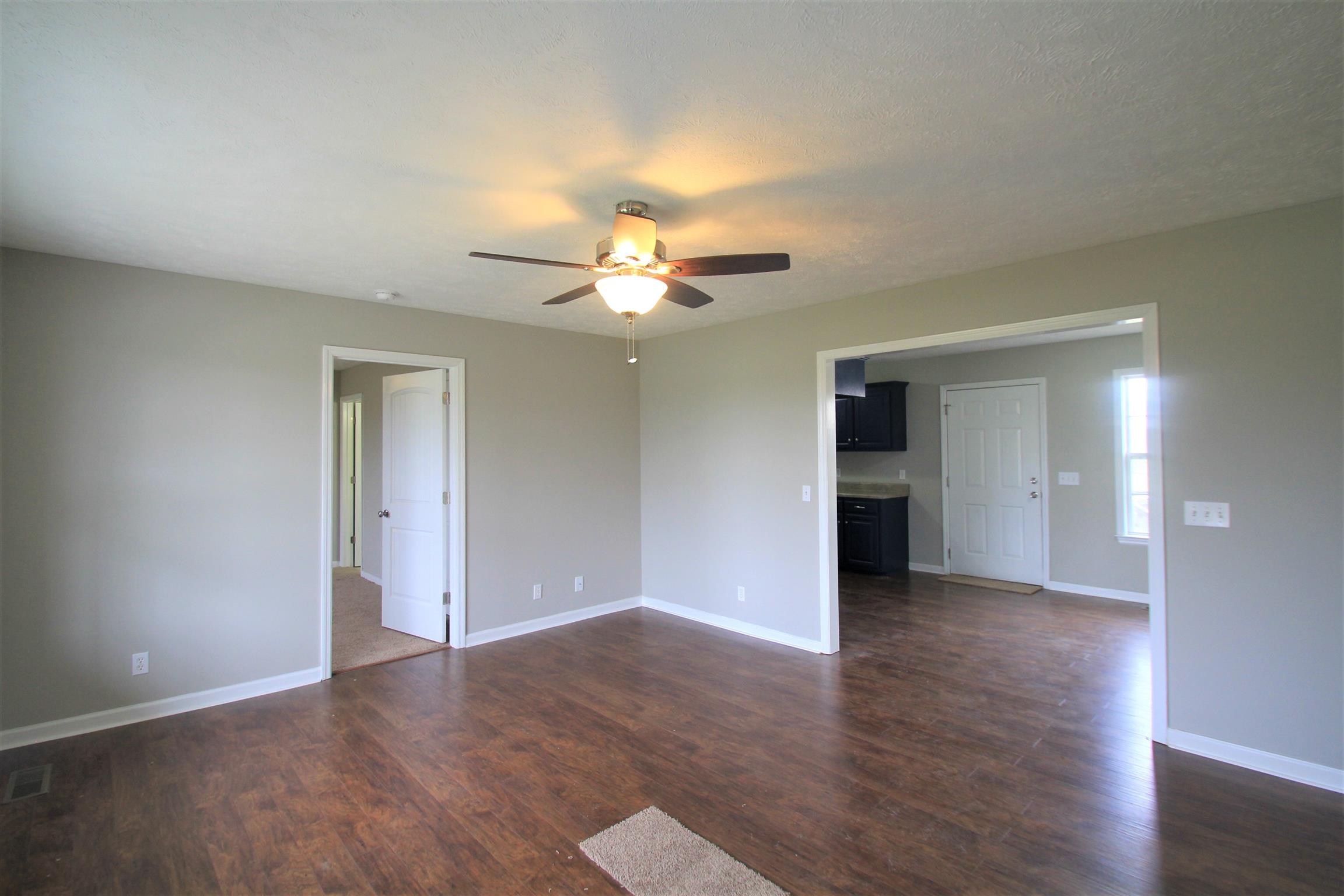 131 Spry Road Morrison, TN 37357 - Photo 3 of 11 a view of an empty room with wooden floor