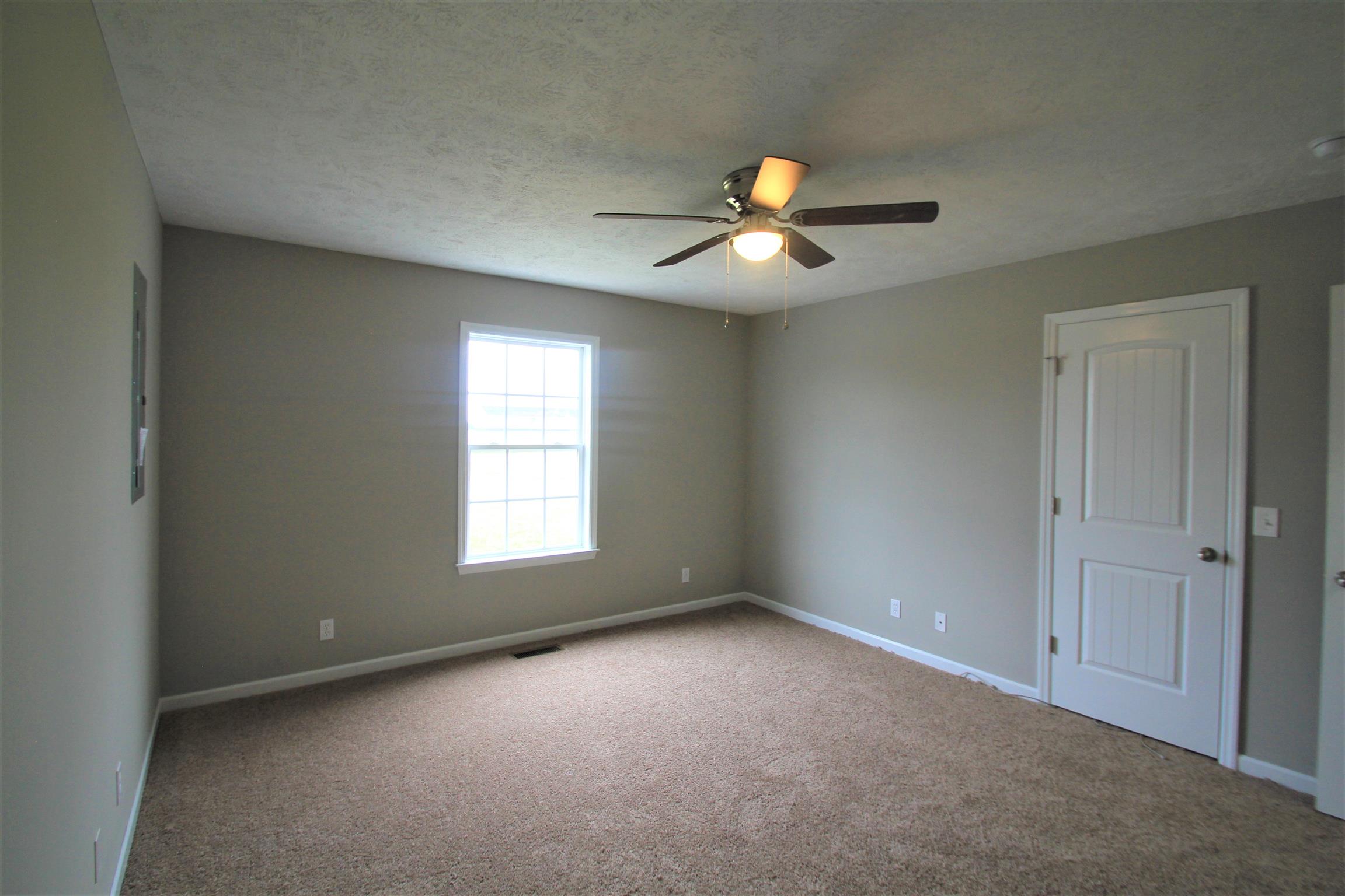 131 Spry Road Morrison, TN 37357 - Photo 10 of 11 a view of an empty room with a window