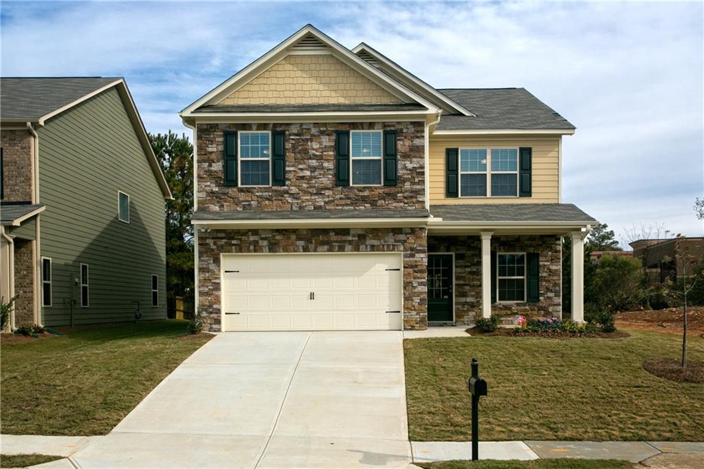 3944 Overlook Ridge Lane Gainesville, GA 30507 - Photo 1 of 1 a front view of a house with a garden