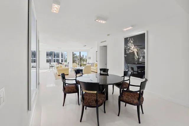 a kitchen with stainless steel appliances granite countertop a refrigerator sink and stove