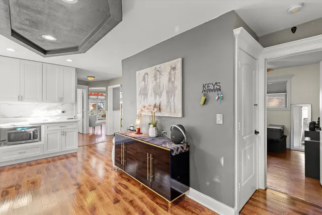 a spacious bathroom with a double vanity sink a mirror and a bathtub