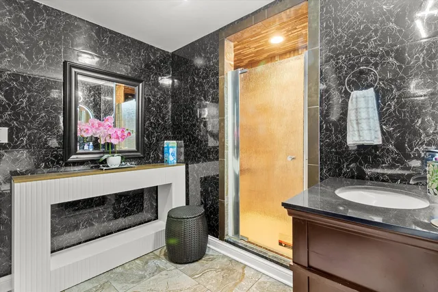 a bathroom with a sink and a mirror