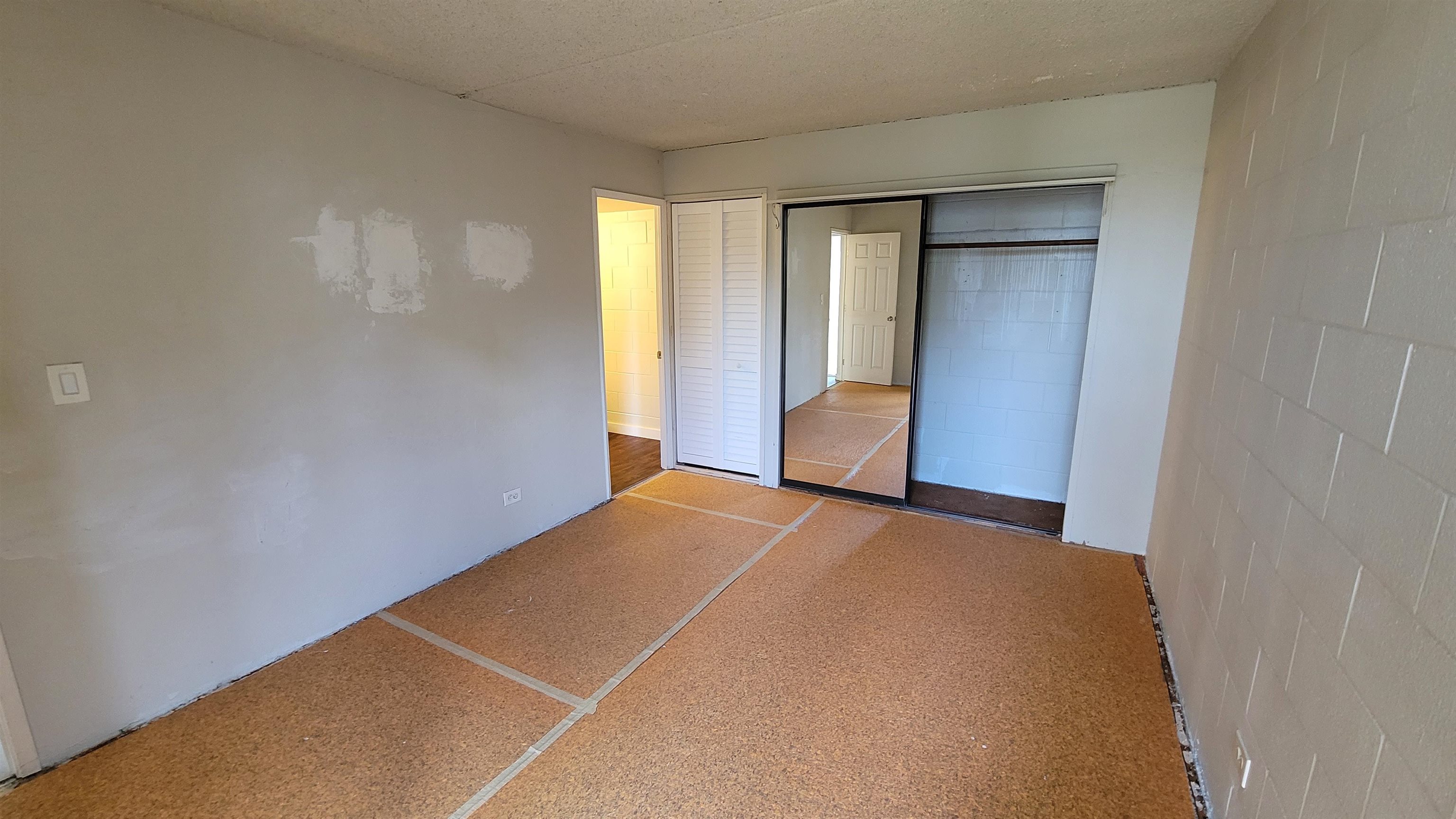 111 Kahului Beach Road, Unit B301 Kahului, HI 96732 - Photo 11 of 20 a view of an empty room with wooden floor
