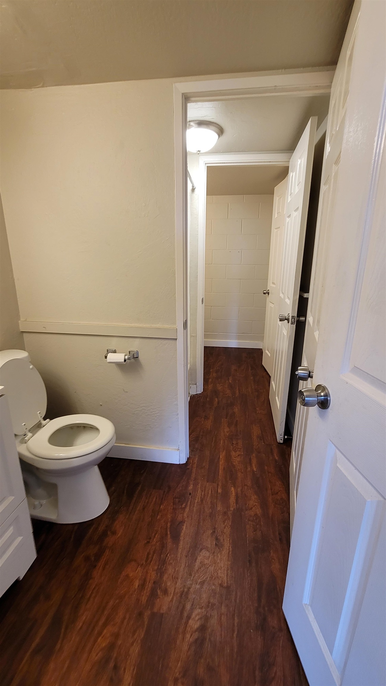 111 Kahului Beach Road, Unit B301 Kahului, HI 96732 - Photo 16 of 20 a bathroom with a toilet and a wooden floor
