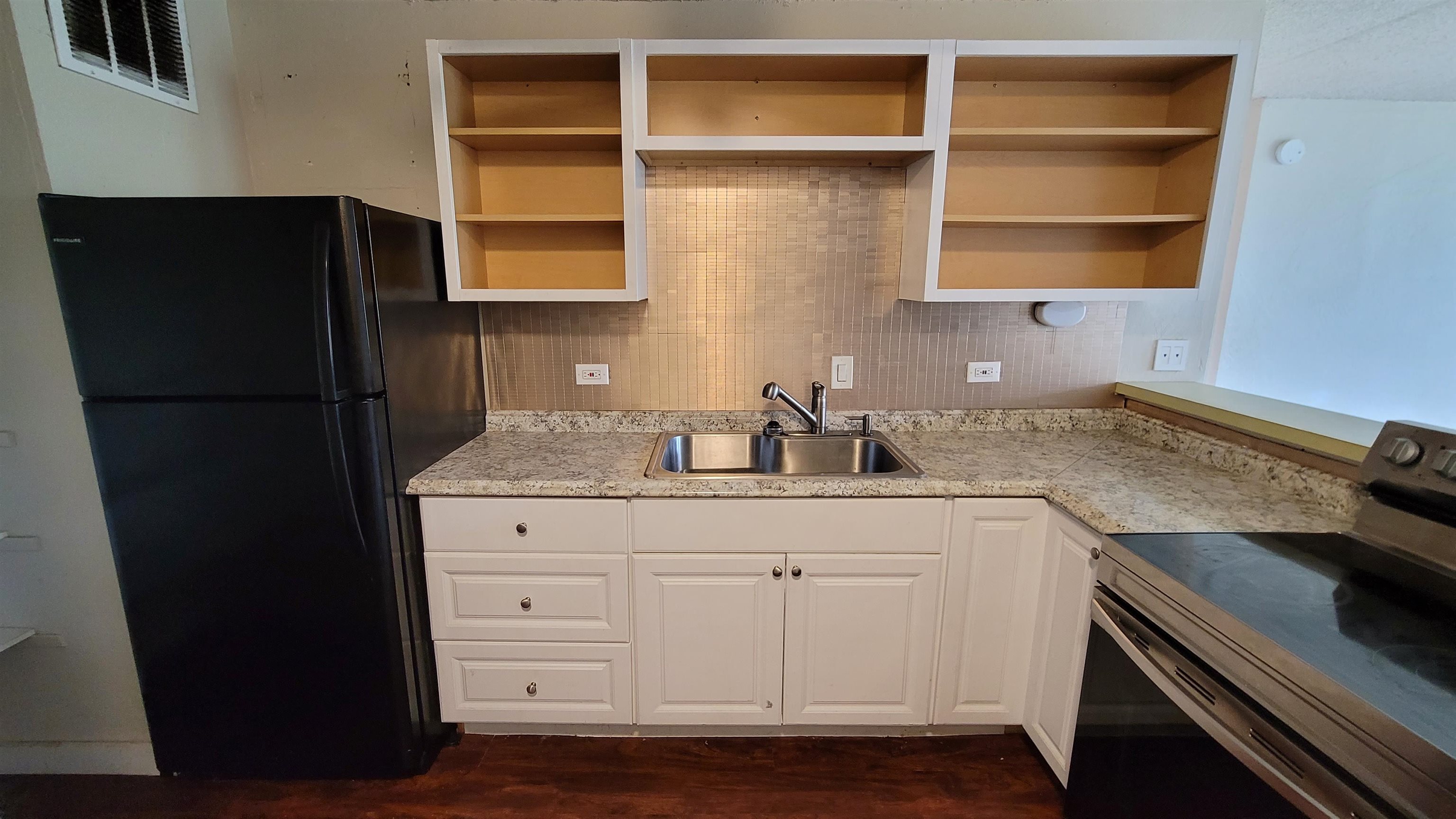 111 Kahului Beach Road, Unit B301 Kahului, HI 96732 - Photo 2 of 20 a kitchen with a refrigerator and a sink