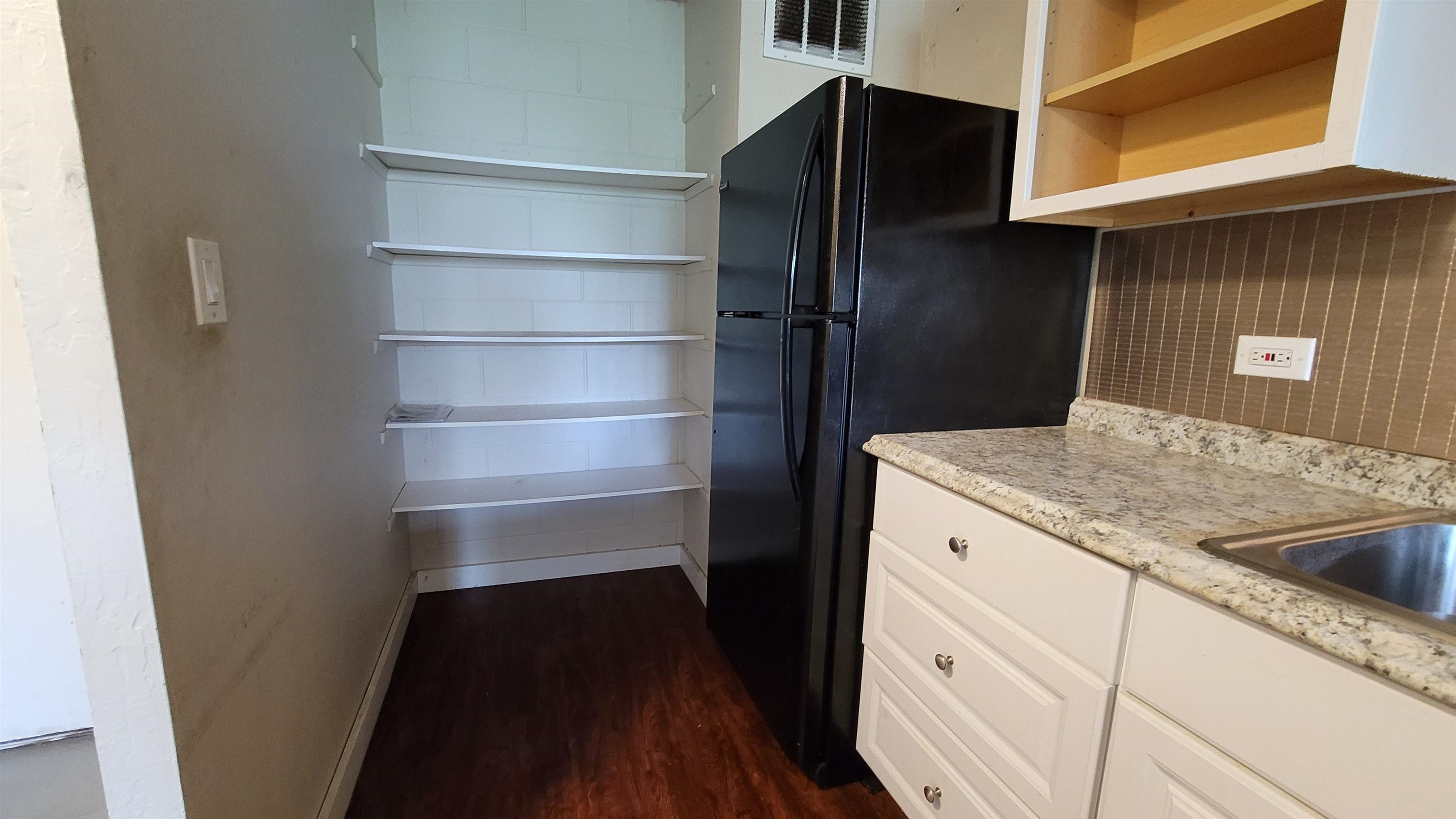 111 Kahului Beach Road, Unit B301 Kahului, HI 96732 - Photo 3 of 20 a kitchen with a refrigerator and a sink