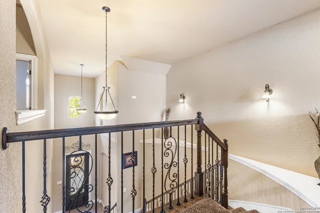 a view of a hallway with windows
