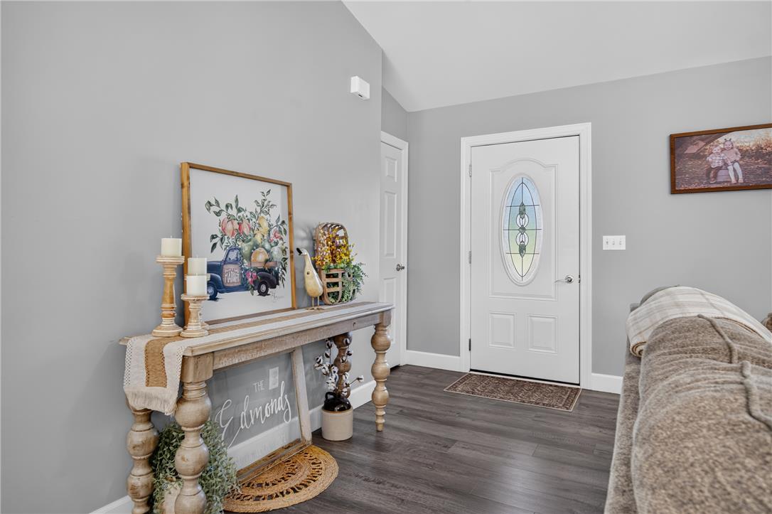 74 Kepners Road New Ringgold, PA 17960 - Photo 4 of 79 An inviting entryway features durable wood-look flooring and an ornate glass-inserted front door.