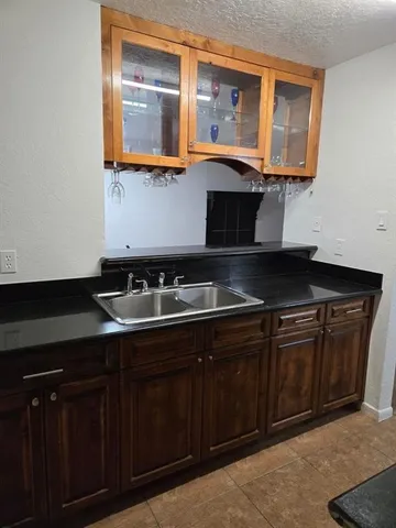 a stove top oven sitting inside of a kitchen