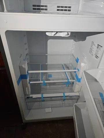 a view of a livingroom with a ceiling fan and window