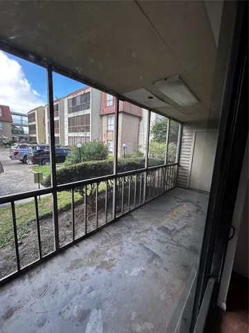 a view of a room with a large window