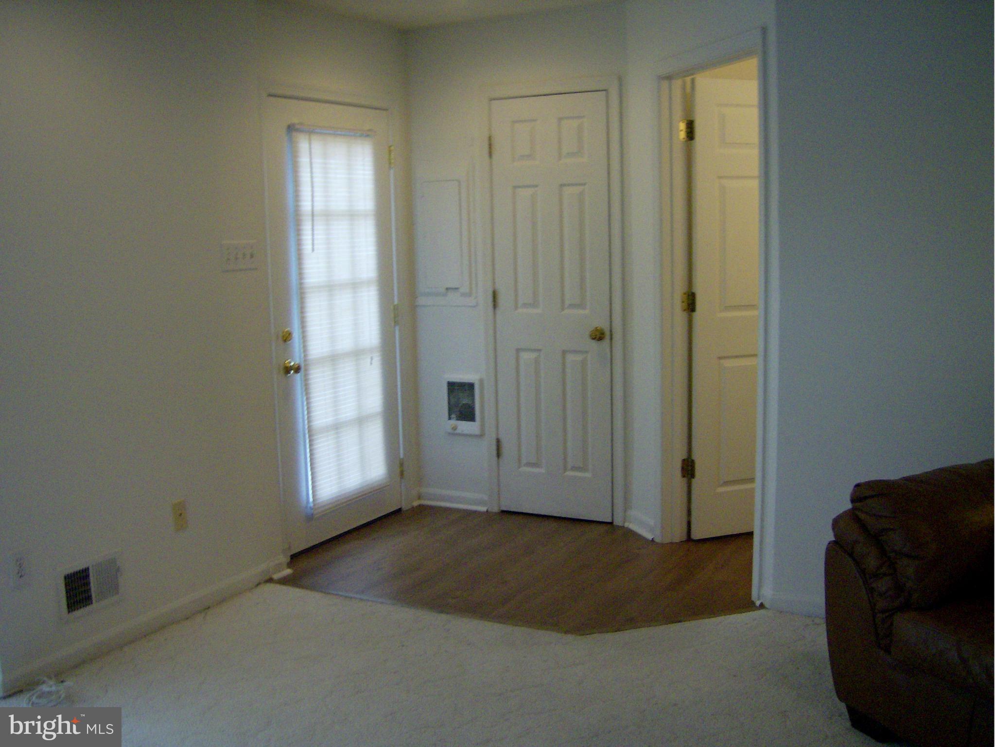 4230 Maple Path Circle, Unit 19 Nottingham, MD 21236 - Photo 8 of 19 an empty room with windows