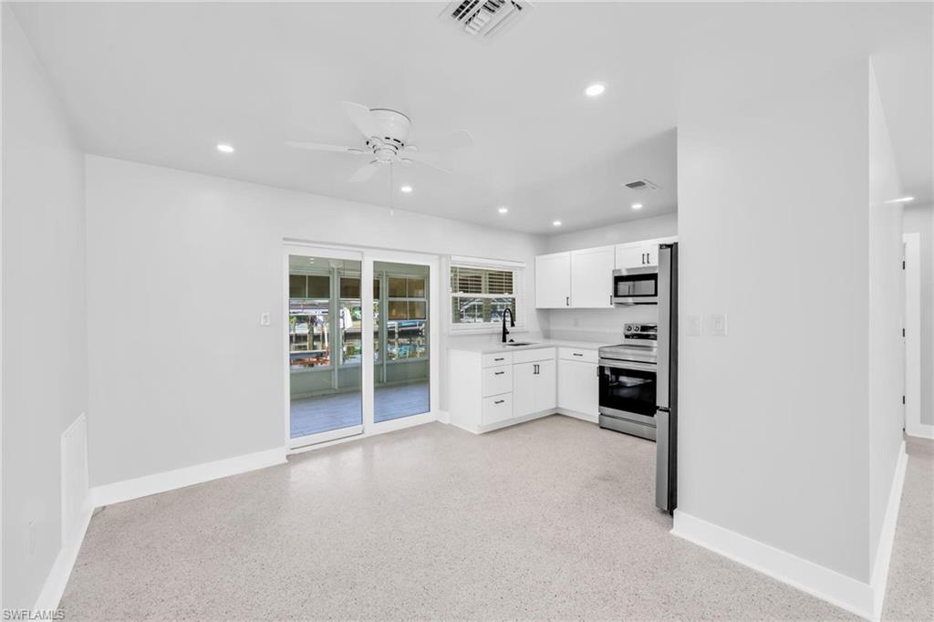 2822 Bruce Street Matlacha, FL 33993 - Photo 14 of 26 a kitchen with stainless steel appliances a refrigerator and a sink
