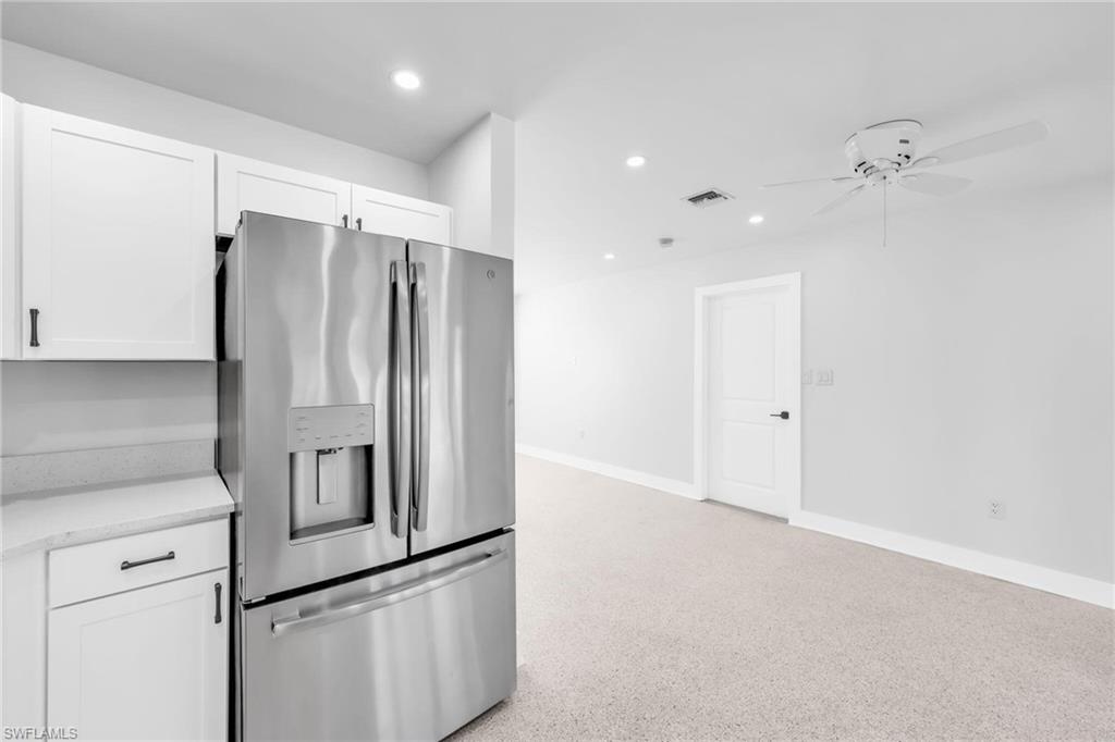 2822 Bruce Street Matlacha, FL 33993 - Photo 16 of 26 a kitchen with stainless steel appliances a refrigerator and a cabinets