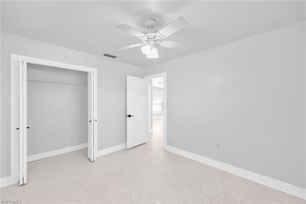 2822 Bruce Street Matlacha, FL 33993 - Photo 22 of 26 a view of an empty room with a ceiling fan