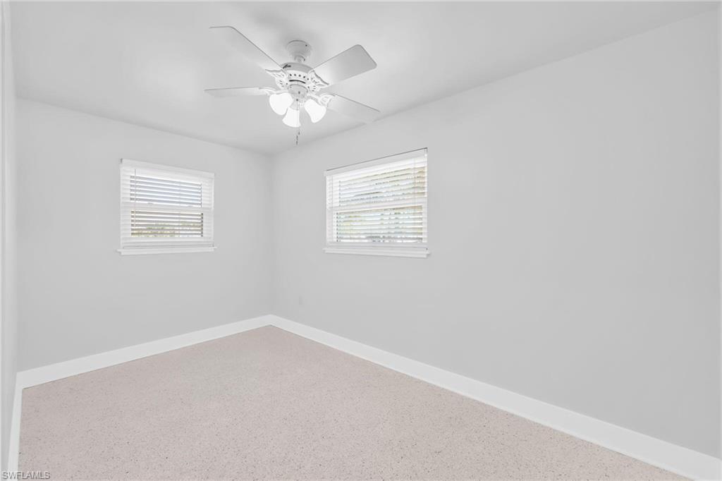 2822 Bruce Street Matlacha, FL 33993 - Photo 23 of 26 an empty room with a window