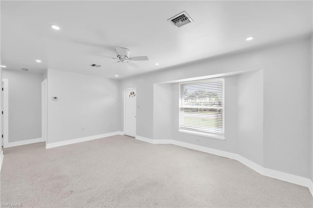 2822 Bruce Street Matlacha, FL 33993 - Photo 9 of 26 an empty room with a window and a ceiling fan