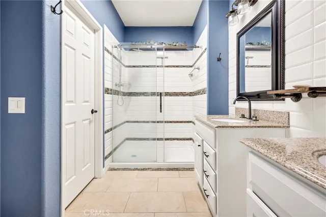 a view of a kitchen with a sink and a large window