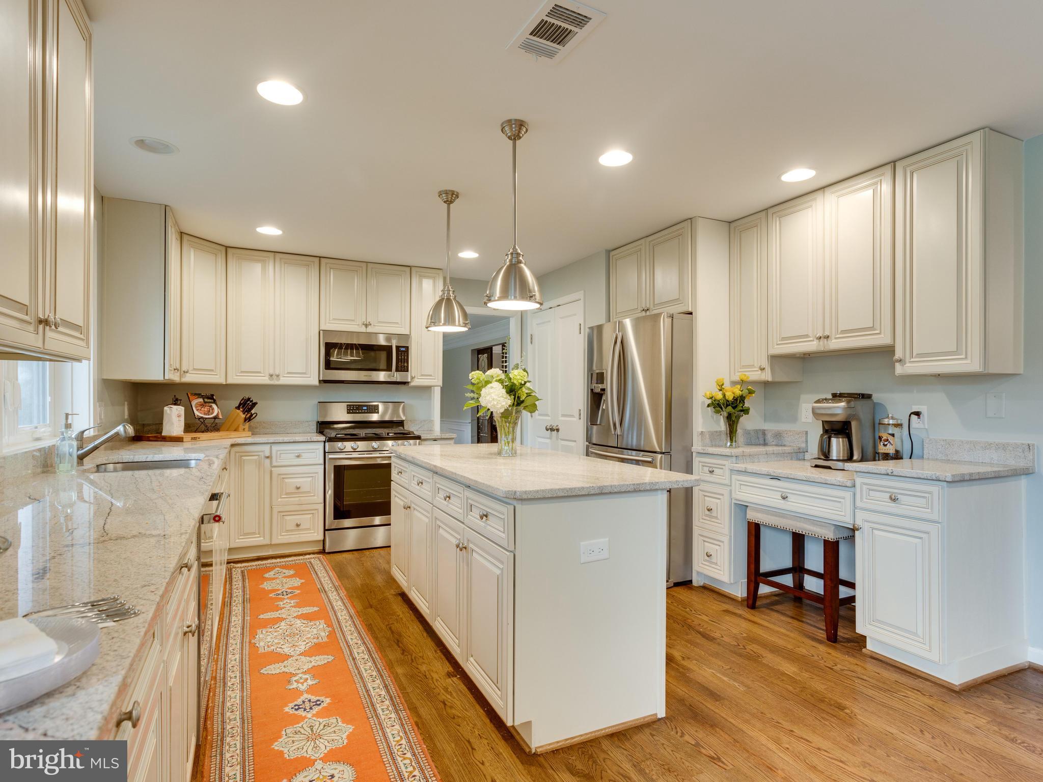11727 Chapel Road Clifton, VA 20124 - Photo 8 of 30 Stainless appliances and white shaker cabinetry
