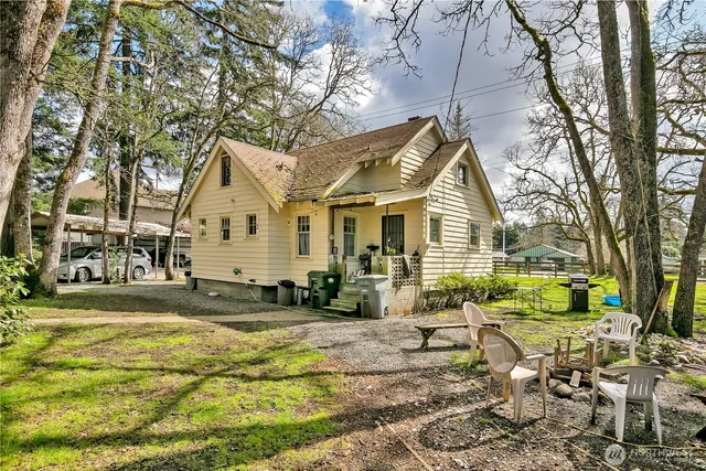 a view of a yard with a house and sitting area
