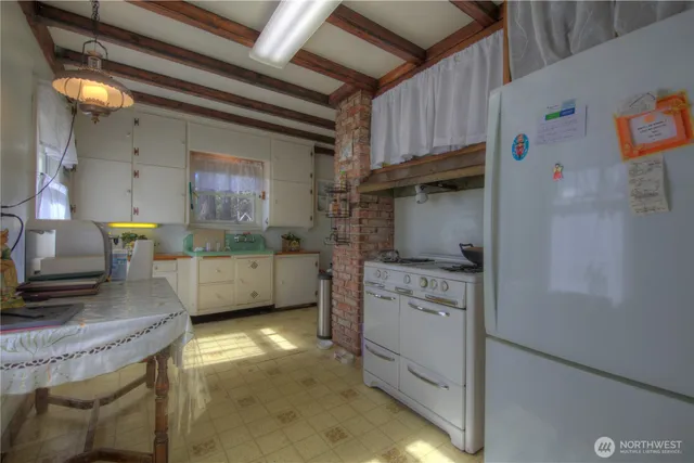a kitchen with cabinets a sink and a stove