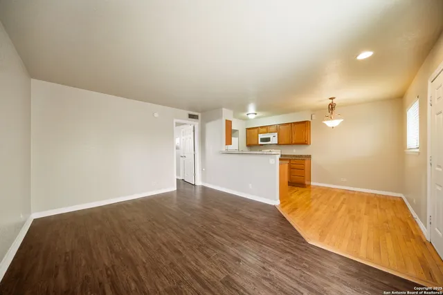 a view of a kitchen with wooden floor