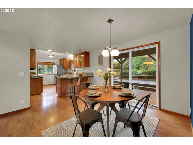 a dining room with furniture and window