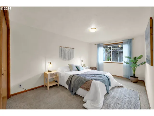 a bedroom with a bed and a lamp