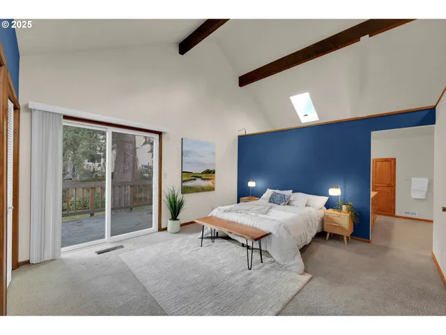 a bedroom with a bed and a potted plant