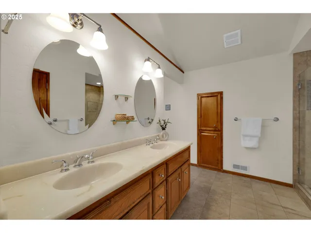 a bathroom with a sink a vanity and mirror
