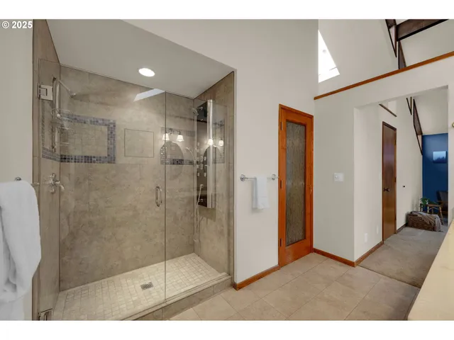 a bathroom with a bathtub sink and mirror