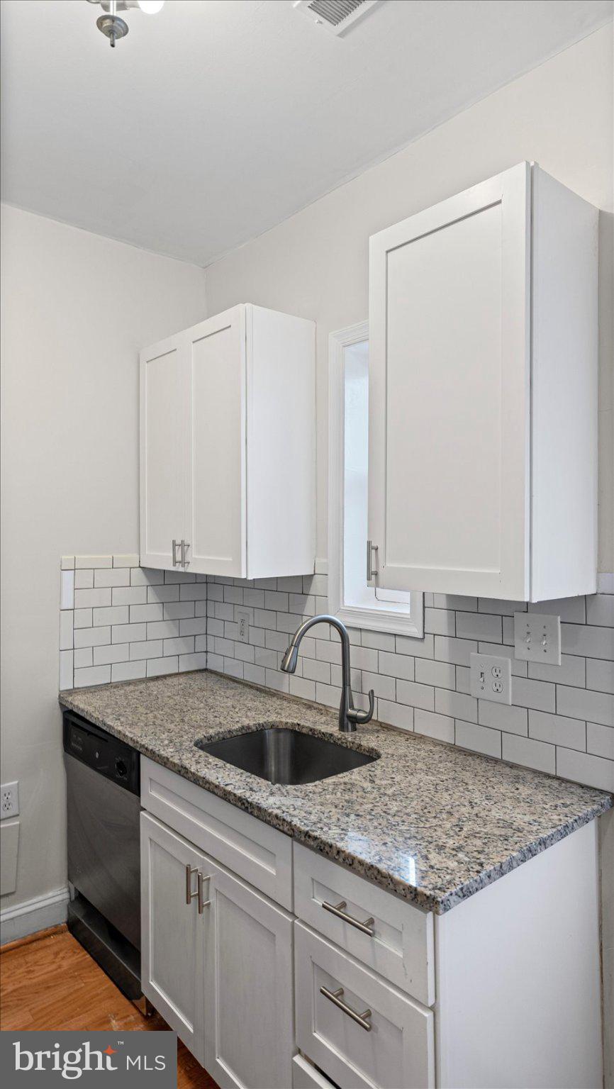 847 Carroll Street Baltimore, MD 21230 - Photo 9 of 33 Modern kitchen with sleek finishes.