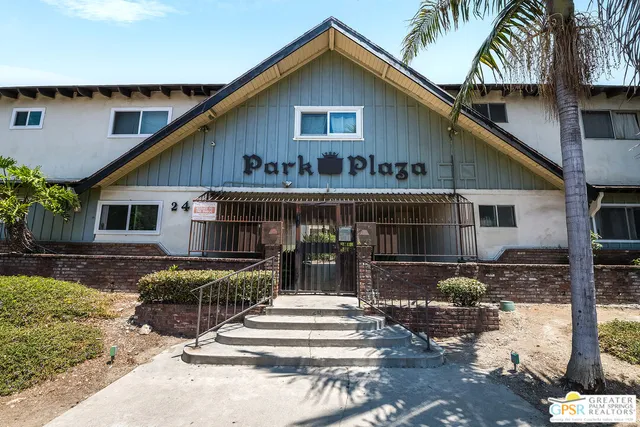 a front view of house with yard outdoor seating and garage