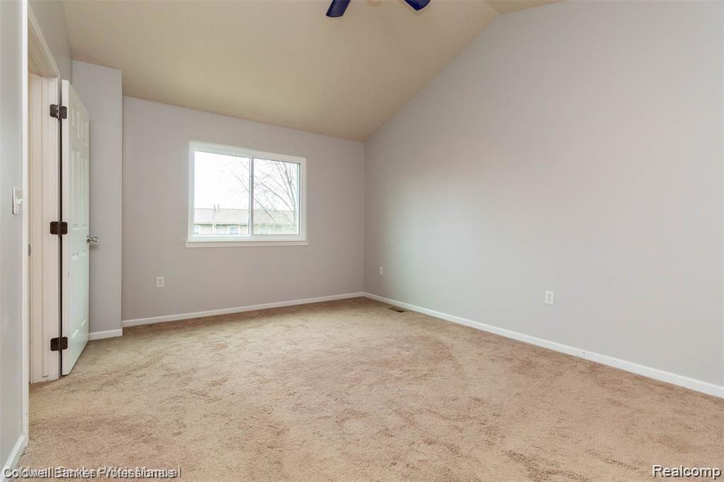 8263 Jeremy Road Belleville, MI 48111 - Photo 18 of 29 Spacious primary ensuite bedroom with ceiling fan, newer window